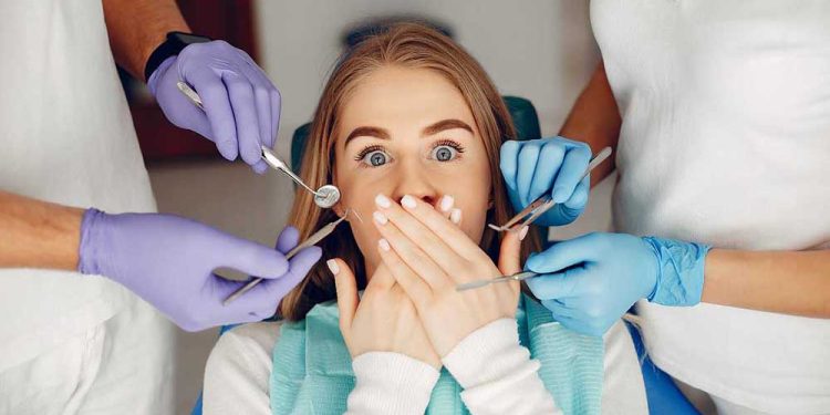 Beautiful lady in the dentist's office. Woman in a uniform